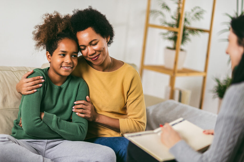 parent and child embracing after learning how to talk to parents about mental health
