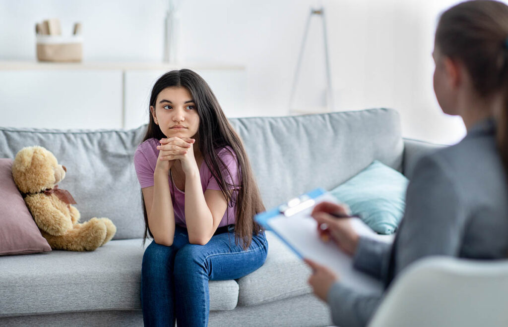 young person in therapy getting answers to the question can adolescent depression be cured